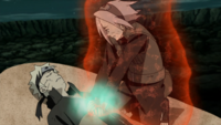 With Naruto in critical condition, Sakura begins treating him.png